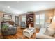 Well-lit living room showcases hardwood floors, neutral walls, and an inviting seating arrangement with traditional decor at 7169 S Grape Ln, Centennial, CO 80122