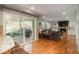 Spacious living room boasts a stone fireplace, backyard access, and a large, comfortable gray sectional sofa at 7169 S Grape Ln, Centennial, CO 80122
