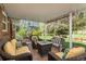 Outdoor patio area featuring comfortable seating around a fire pit and landscaped backyard at 7169 S Grape Ln, Centennial, CO 80122