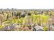 Aerial view showcasing the property's neighborhood, with mature trees and a view of the surrounding cityscape at 2235 S Fillmore St, Denver, CO 80210