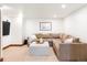 Cozy basement living room featuring a comfortable sectional sofa and ambient lighting for relaxation at 2235 S Fillmore St, Denver, CO 80210