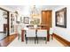 Open dining area featuring modern lighting, stylish decor, and a seamless transition to the kitchen at 2235 S Fillmore St, Denver, CO 80210