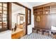 Cozy entryway featuring a custom wood built-in bench, storage, and a geometric patterned rug at 2235 S Fillmore St, Denver, CO 80210