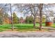 Scenic view of the neighborhood with lush greenery, historic buildings, and a vibrant park setting at 2235 S Fillmore St, Denver, CO 80210