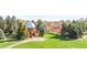 Classic observatory with a beautiful dome, surrounded by mature trees and a vibrant green lawn in a park setting at 2235 S Fillmore St, Denver, CO 80210