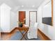 Bright office featuring a desk, chair, wood floors and a modern art piece at 2235 S Fillmore St, Denver, CO 80210