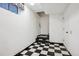 Basement features black and white checkered flooring at 2883 W Long Cir # E, Littleton, CO 80120
