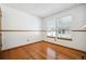Bedroom with hardwood floors and plenty of natural light from two windows at 2883 W Long Cir # E, Littleton, CO 80120