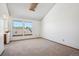 Bright bedroom featuring carpet, two windows, and vaulted ceilings at 2883 W Long Cir # E, Littleton, CO 80120
