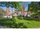 Inviting townhome with mature trees, lush lawn, and a charming white picket fence at 2883 W Long Cir # E, Littleton, CO 80120