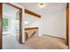 Upstairs hallway features a skylight and an open railing for an airy feel at 2883 W Long Cir # E, Littleton, CO 80120