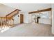 Inviting living area with stairs and a view to the kitchen's breakfast bar at 2883 W Long Cir # E, Littleton, CO 80120
