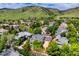Aerial view of the home with a mountain view, nestled in a neighborhood surrounded by lush greenery at 4921 Fountain St, Boulder, CO 80304