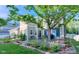 Backyard patio area featuring mature trees, landscaping, and outdoor seating area at 4921 Fountain St, Boulder, CO 80304
