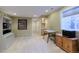 Finished basement area with neutral carpet, desk, storage, and nearby bathroom at 4921 Fountain St, Boulder, CO 80304