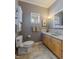 Cozy bathroom with marble countertop, decorative wall shelf, and natural light at 4921 Fountain St, Boulder, CO 80304
