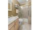Bathroom with tiled shower and glass door, toilet, and modern vanity at 4921 Fountain St, Boulder, CO 80304