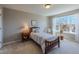 Cozy bedroom with a comfortable bed, side table, and a bright window with natural light at 4921 Fountain St, Boulder, CO 80304