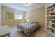 Cozy bedroom features a built-in bookcase and view to the outdoors at 4921 Fountain St, Boulder, CO 80304