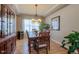 Elegant dining room with hardwood floors, tray ceilings, a chandelier, and a large wooden hutch at 4921 Fountain St, Boulder, CO 80304