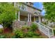 Beautiful home with a covered front porch, stone accents, well-manicured landscaping, and great curb appeal at 4921 Fountain St, Boulder, CO 80304