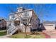 Two-story home showcasing stone accents, charming exterior, garage and a well-maintained lawn at 4921 Fountain St, Boulder, CO 80304