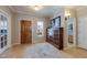 Foyer with hardwood floors, wooden door, and view into other rooms at 4921 Fountain St, Boulder, CO 80304