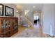 Welcoming foyer with hardwood floors, staircase, and ample natural light at 4921 Fountain St, Boulder, CO 80304