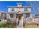 Inviting two-story home with a covered front porch, stone accents, and well-maintained lawn at 4921 Fountain St, Boulder, CO 80304