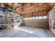 Garage with overhead lighting, shelving, and garage door at 4921 Fountain St, Boulder, CO 80304