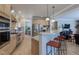 Modern kitchen featuring a breakfast bar with seating, stainless steel appliances and light wood cabinets at 4921 Fountain St, Boulder, CO 80304