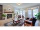 Bright living room featuring a fireplace, large windows, and comfortable seating at 4921 Fountain St, Boulder, CO 80304