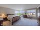 Serene main bedroom with neutral tones, two windows, and minimalist furnishings at 4921 Fountain St, Boulder, CO 80304