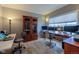 Bright home office with multiple monitors, built-in storage, hardwood floors, and ample natural light at 4921 Fountain St, Boulder, CO 80304