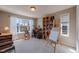 Bright office with multiple windows, a desk, and custom bookshelves for storage at 4921 Fountain St, Boulder, CO 80304