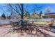 Cozy patio with stone pavers, outdoor seating, a manicured yard, and a white picket fence at 4921 Fountain St, Boulder, CO 80304