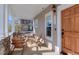 Cozy front porch with comfortable seating, wood furnishings and charming outdoor space at 4921 Fountain St, Boulder, CO 80304