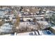 Aerial view of residential property, showcasing the house and surrounding snowy landscape at 1435 Quebec St, Denver, CO 80220
