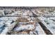 Aerial view of property, showing the house and surrounding neighborhood in winter at 1435 Quebec St, Denver, CO 80220