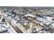 Aerial view of a house and lot in a snow-covered neighborhood at 1435 Quebec St, Denver, CO 80220