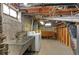 Unfinished basement with laundry and storage areas at 1435 Quebec St, Denver, CO 80220