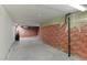 Unfinished basement with exposed brick walls at 1435 Quebec St, Denver, CO 80220