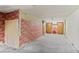 Unfinished basement with storage and brick walls at 1435 Quebec St, Denver, CO 80220