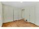 Bedroom with hardwood floors and double door closets at 1435 Quebec St, Denver, CO 80220