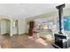 Bright living room with hardwood floors and wood burning stove at 1435 Quebec St, Denver, CO 80220