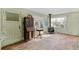 Spacious living room features hardwood floors, wood burning stove, and large windows at 1435 Quebec St, Denver, CO 80220