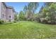 Large green backyard offers ample space for outdoor activities and enjoyment at 2215 Parkview Dr, Longmont, CO 80504