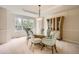 Formal dining room with stylish lighting, a modern cabinet, and comfortable seating for guests at 2215 Parkview Dr, Longmont, CO 80504