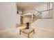 Elegant entryway featuring a staircase, a unique statue, and views of the upper level at 2215 Parkview Dr, Longmont, CO 80504