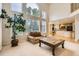 Open living area with a fireplace, large windows, and seamless access to the kitchen at 2215 Parkview Dr, Longmont, CO 80504
